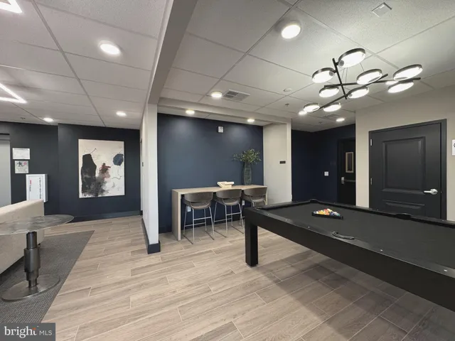 a view of a lobby with furniture and a chandelier
