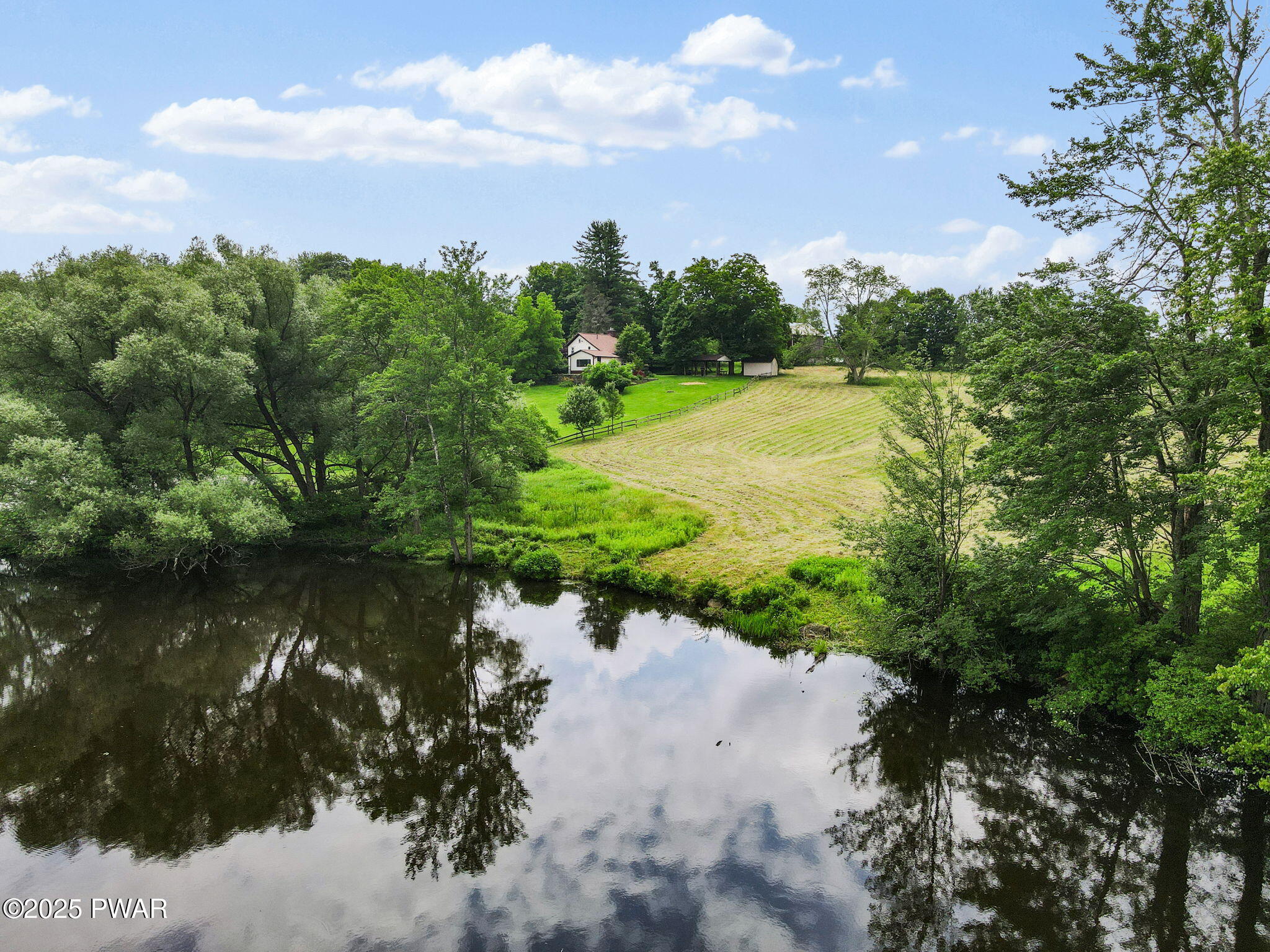 1467 Cortez Road Lake Ariel, PA 18436 - Photo 27 of 36 a view of a lake with a yard