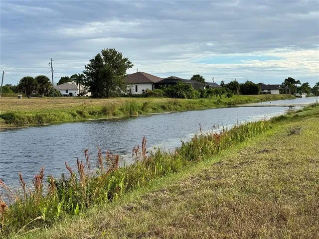 a view of a lake with a big yard