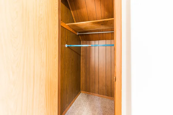 a view of a big room with wooden floor and closet