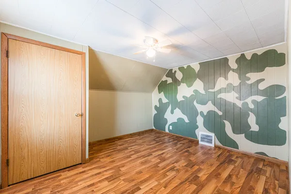 a bathroom with a sink mirror vanity and toilet