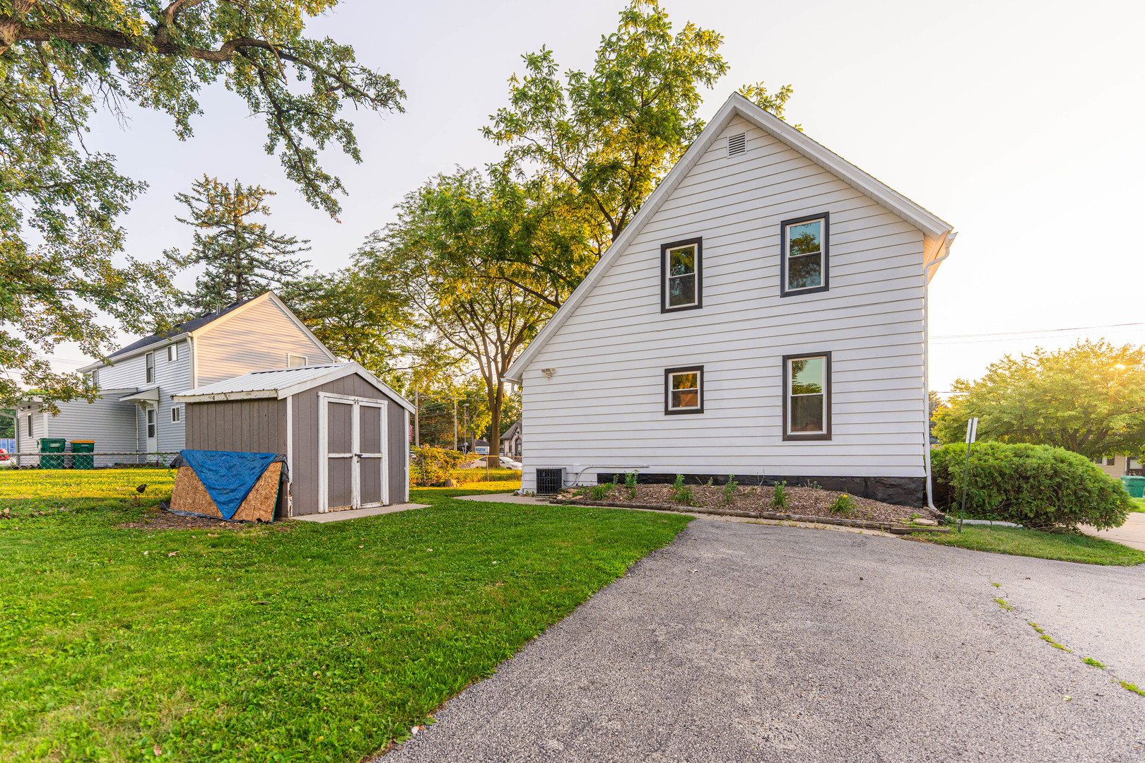 120 Sabin Street Sycamore, IL 60178 - Photo 23 of 27 a view of a house with a yard and large trees