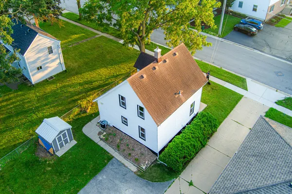 an aerial view of residential houses with outdoor space