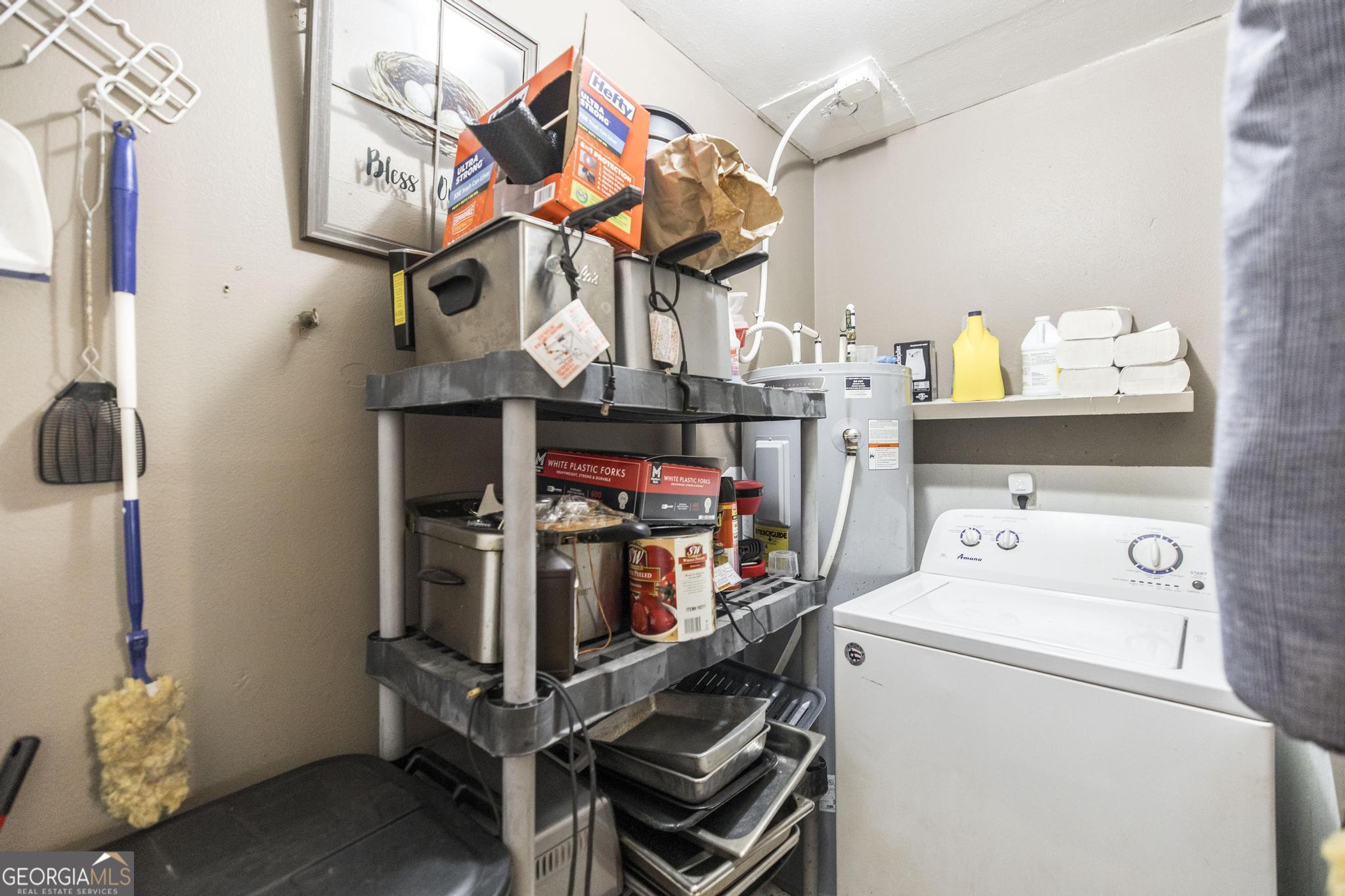 249 Ward Street Warner Robins, GA 31093 - Photo 11 of 22 a storage room with washer and dryer