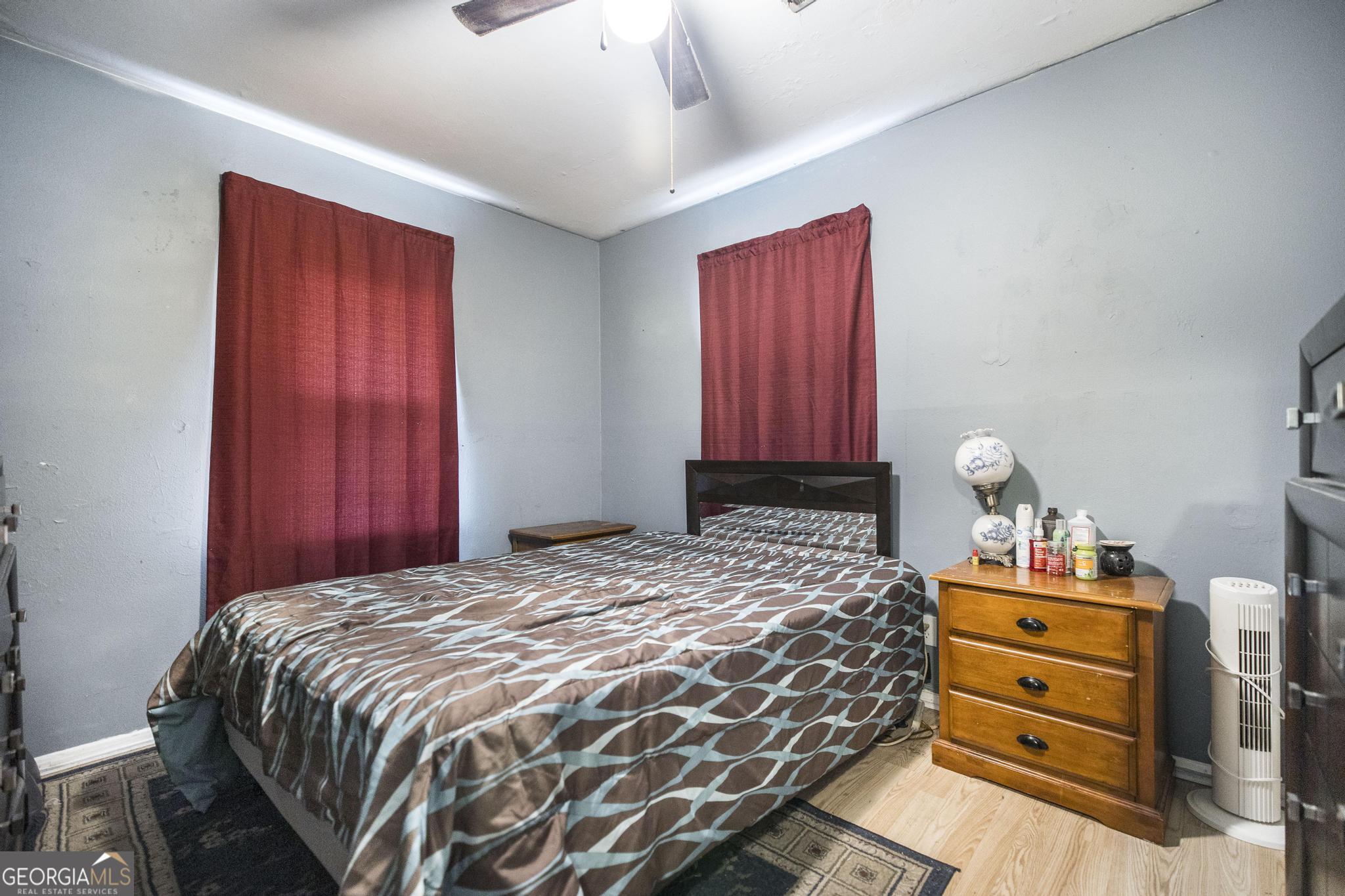249 Ward Street Warner Robins, GA 31093 - Photo 14 of 22 a bedroom with a bed and wooden floor