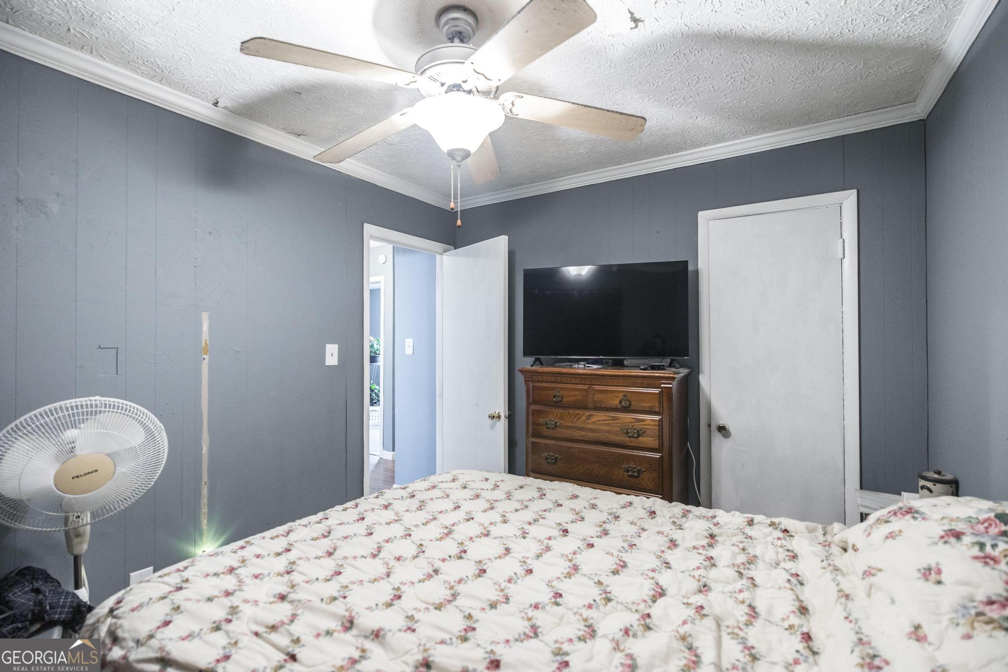 249 Ward Street Warner Robins, GA 31093 - Photo 18 of 22 a bedroom with a bed and a flat screen tv