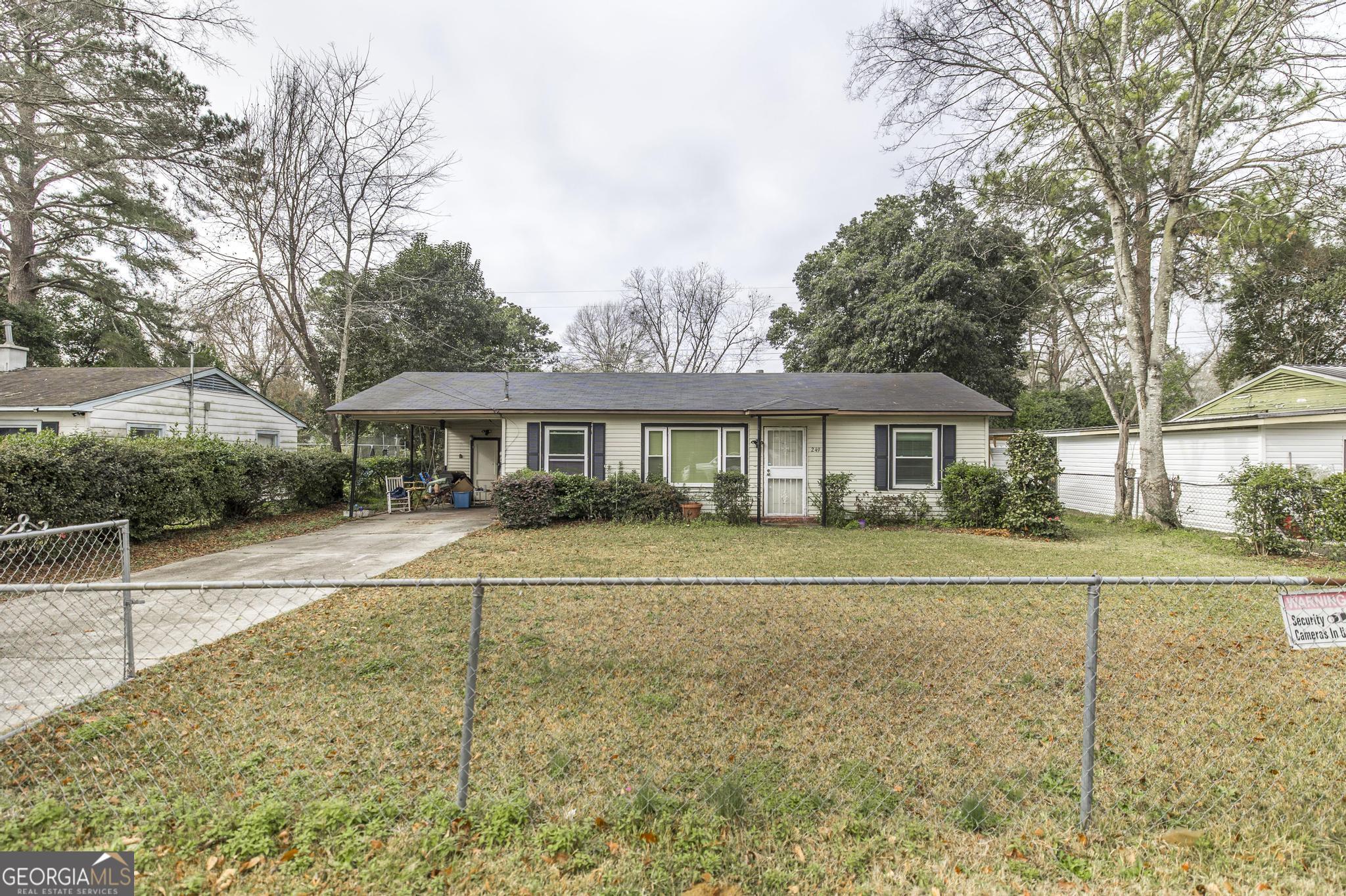 249 Ward Street Warner Robins, GA 31093 - Photo 4 of 22 a front view of a house with a yard