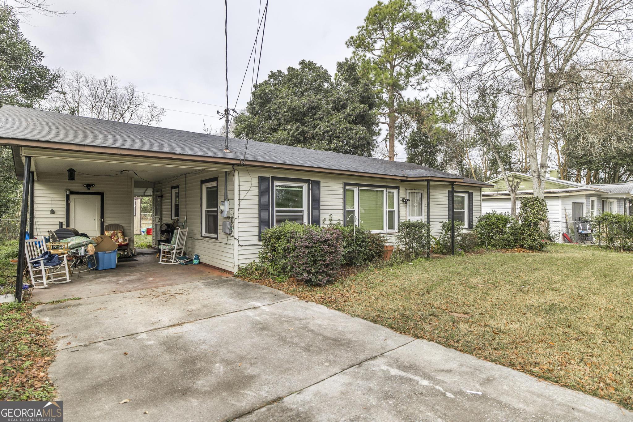 249 Ward Street Warner Robins, GA 31093 - Photo 5 of 22 a view of a house with backyard sitting area and garden