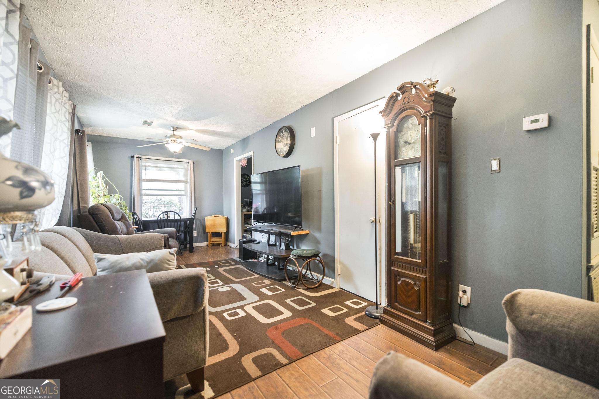 249 Ward Street Warner Robins, GA 31093 - Photo 6 of 22 a living room with furniture and a flat screen tv