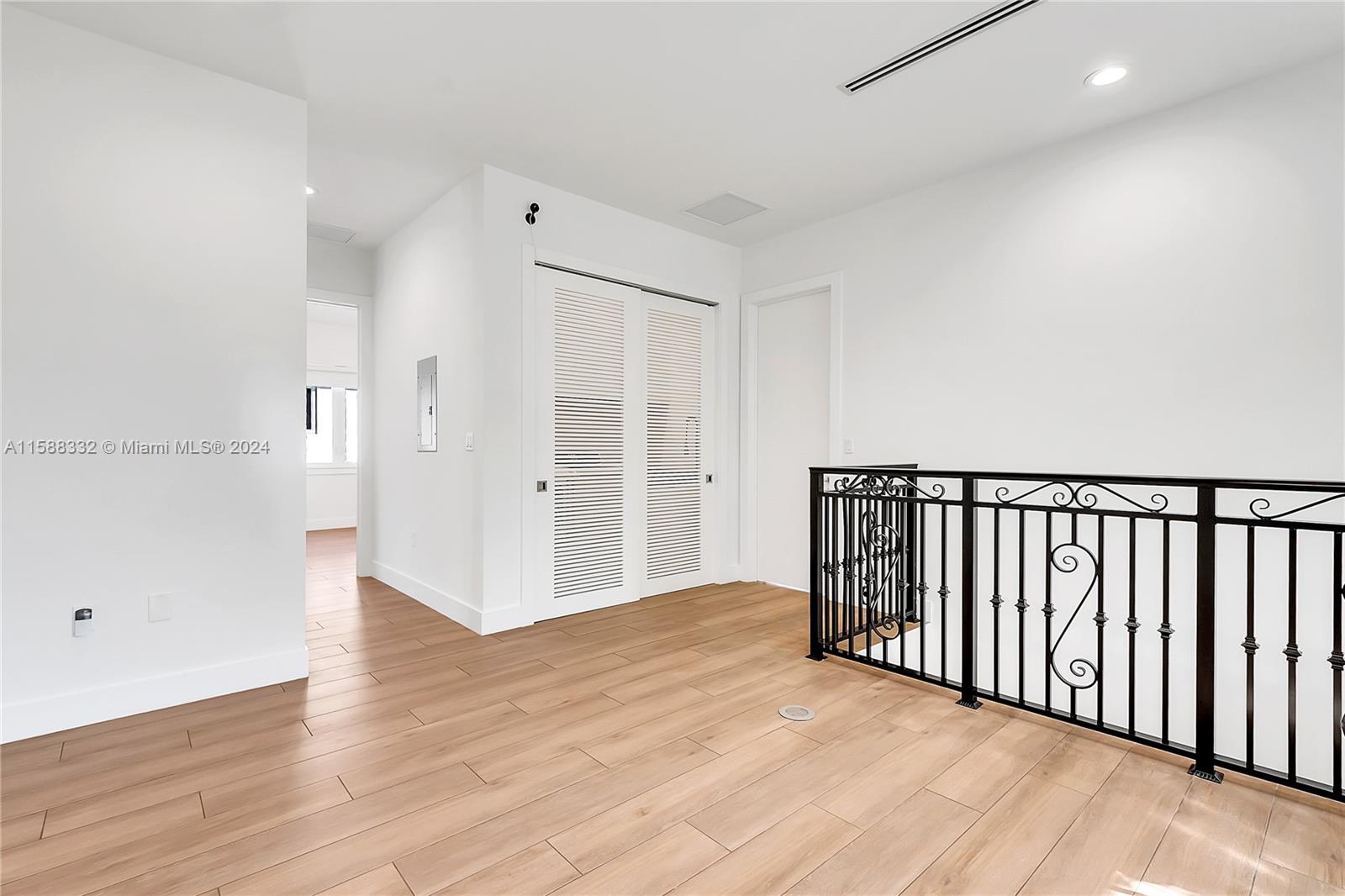 429 Southwest 23rd Road Miami, FL 33129 - Photo 15 of 46 a view of a hallway with wooden floor