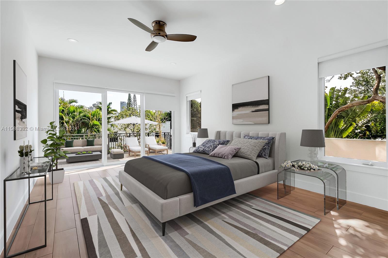 429 Southwest 23rd Road Miami, FL 33129 - Photo 17 of 46 a spacious bedroom with a bed a couch and a large window