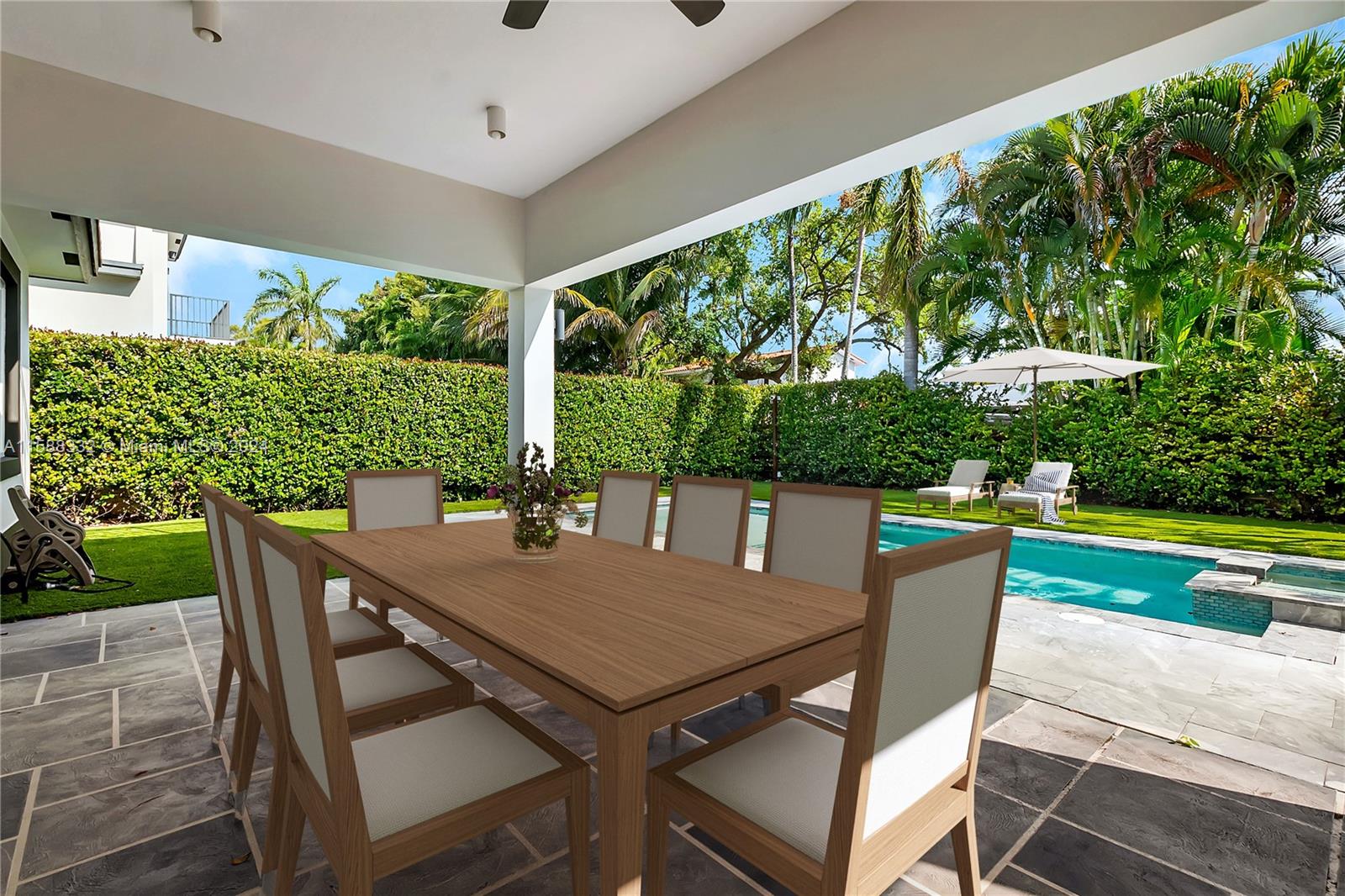 429 Southwest 23rd Road Miami, FL 33129 - Photo 36 of 46 a view of an outdoor dining space with a table and chairs