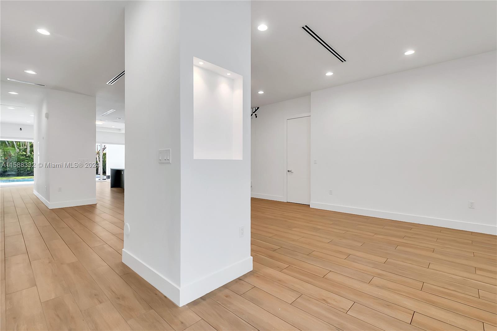 429 Southwest 23rd Road Miami, FL 33129 - Photo 7 of 46 a view of a hallway with wooden floor