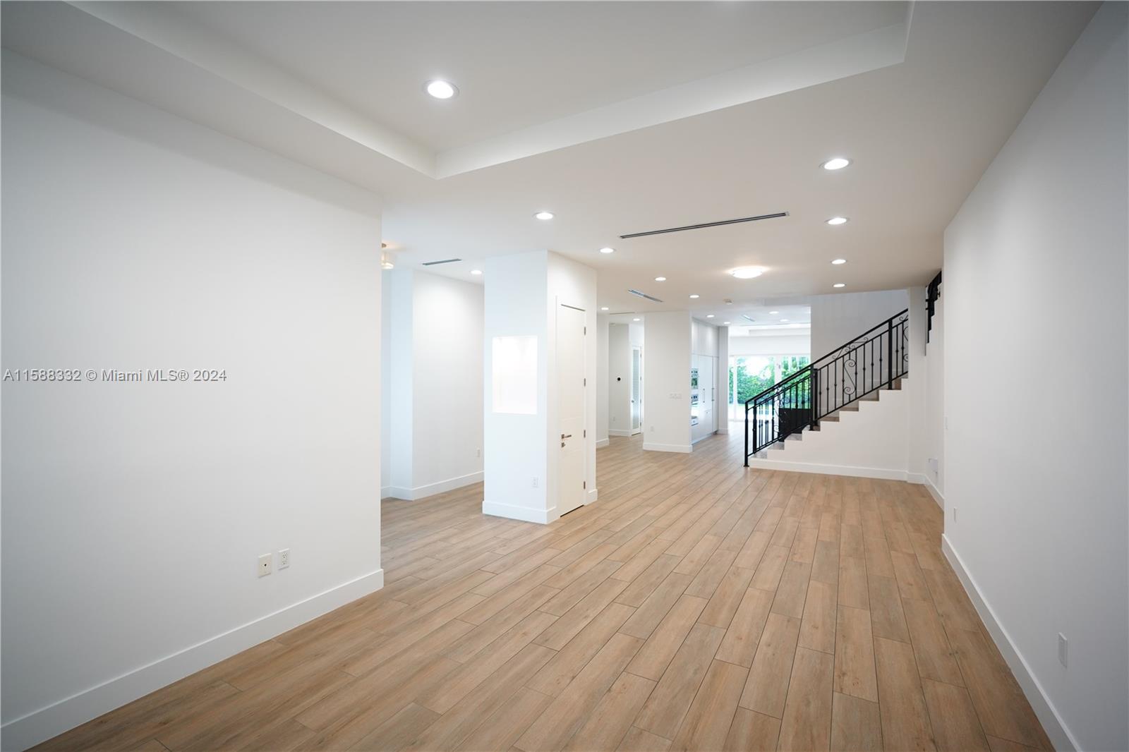 429 Southwest 23rd Road Miami, FL 33129 - Photo 8 of 46 a view of an empty room with wooden floor