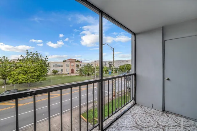 a view of a balcony with wooden fence