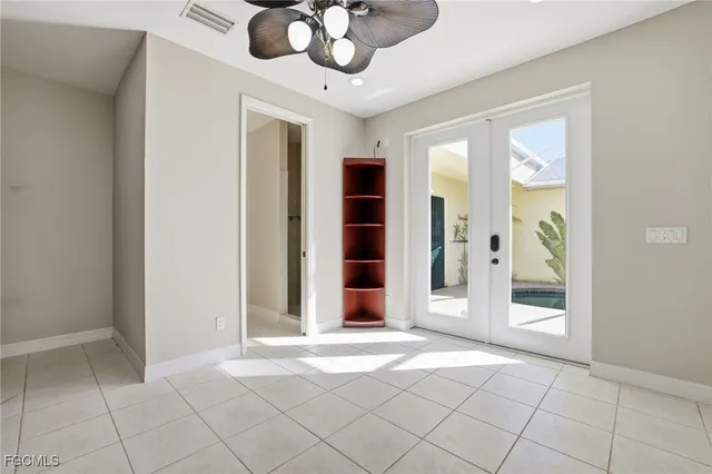 a view of a hallway with wooden floor and entryway