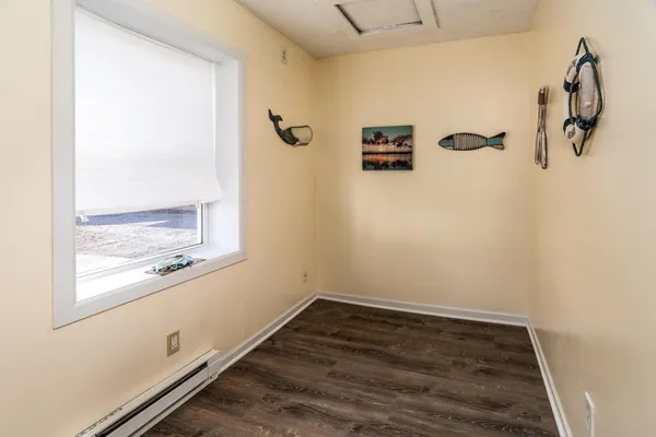 a view of a storage & utility room with wooden floor