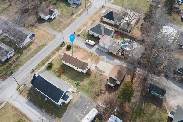 an aerial view of residential house with outdoor space