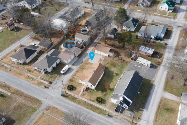 an aerial view of residential house with outdoor space and parking