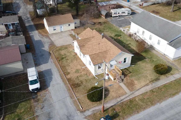 an aerial view of residential house with outdoor space