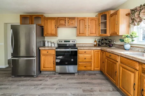 a kitchen with a refrigerator and a sink