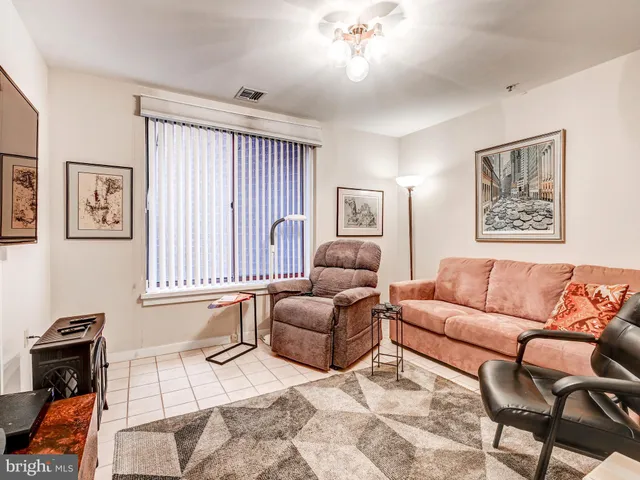 a kitchen with a refrigerator and a sink