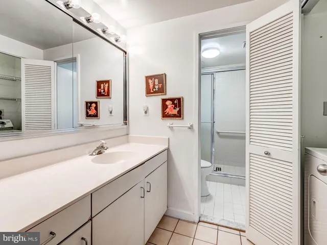 a bedroom with a bed and a table in it