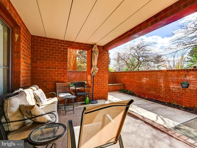 a hallway with cabinets and a stove