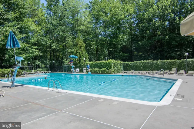 a view of a house with a street and a garage
