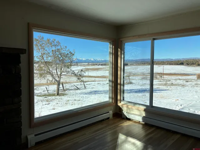 a view of a room with large windows