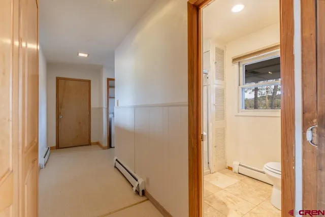 a bathroom with a toilet a sink and bathtub