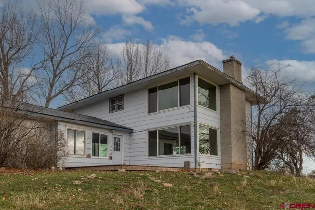 a view of a back yard of the house