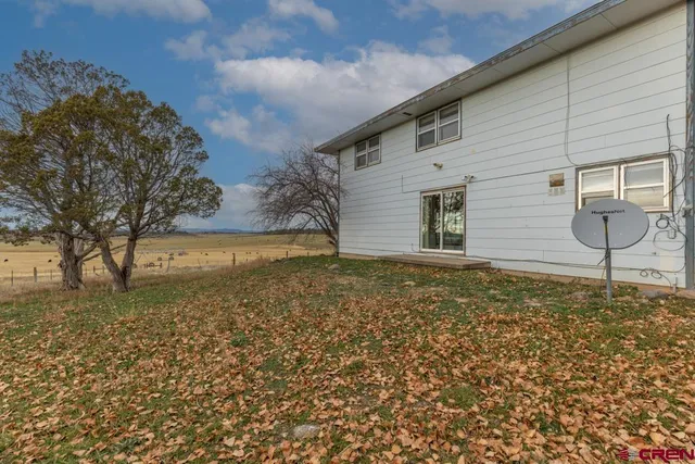 a house view with a backyard space