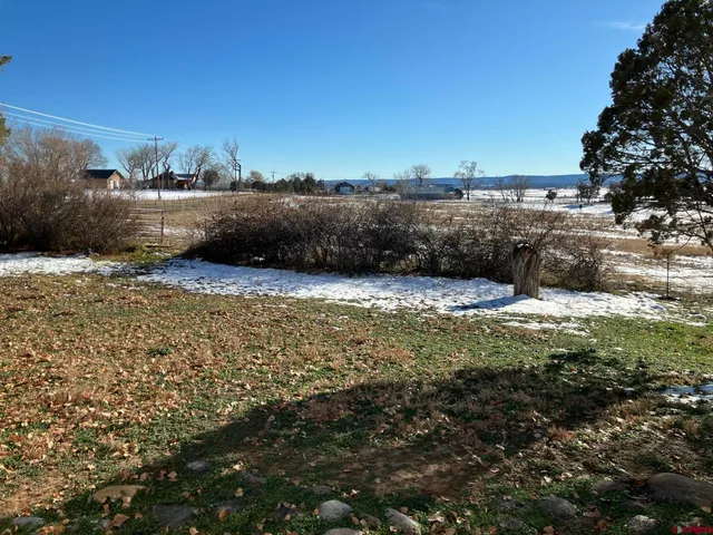 a view of lawn chairs and lake view