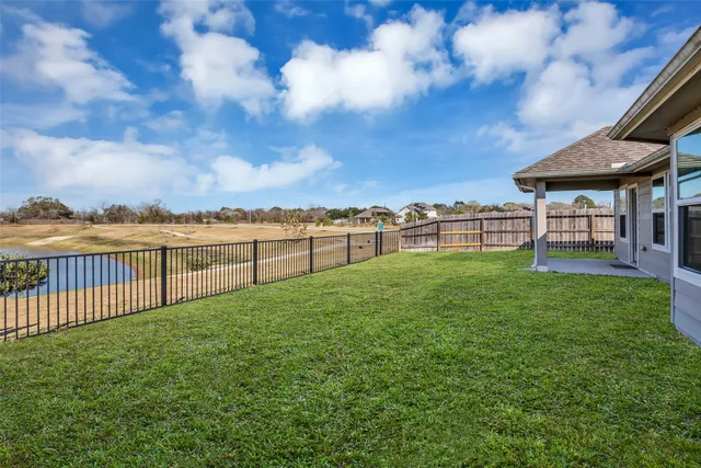 a view of a garden with an outdoor seating