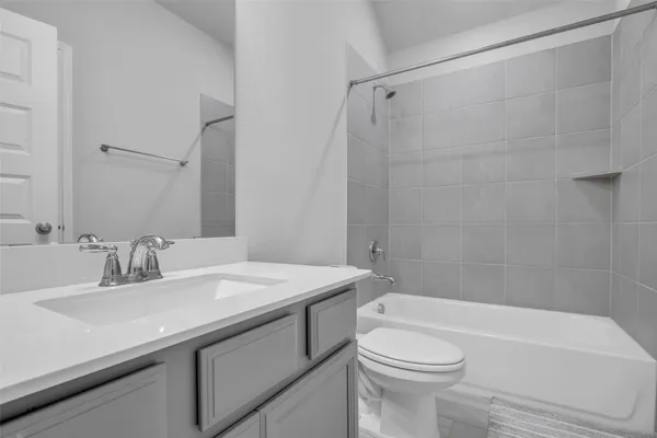 a bathroom with a sink a toilet and a bathtub