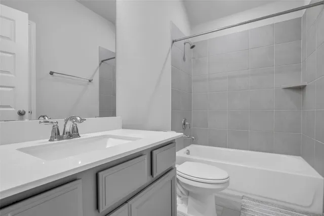 a bathroom with a sink a toilet and a bathtub