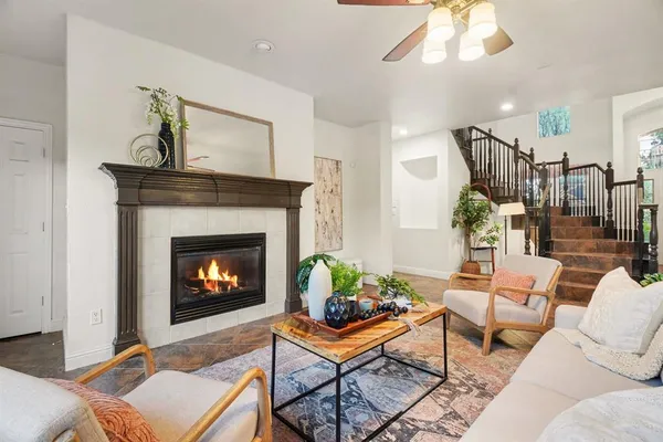 a living room with furniture and a fireplace