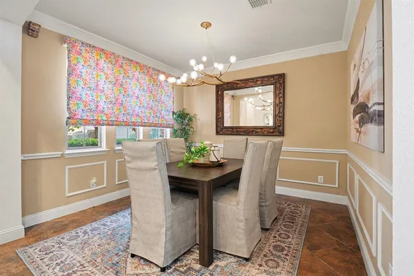 a dining room with furniture a rug and wooden floor