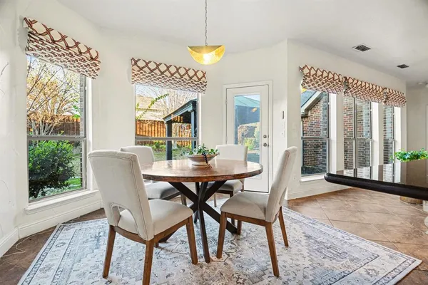 a kitchen with kitchen island a counter top space appliances and cabinets