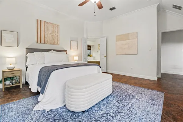 a spacious bedroom with a large bed and a flat screen tv