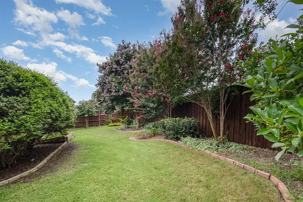 a view of a backyard with a small cabin