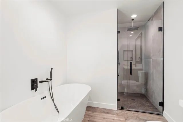 a bathroom with a shower and a sink