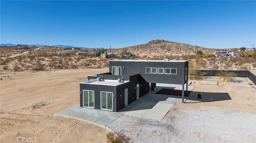 3460 Stonehill Avenue Joshua Tree, CA 92252 - Photo 26 of 27 a view of a terrace with a ocean view