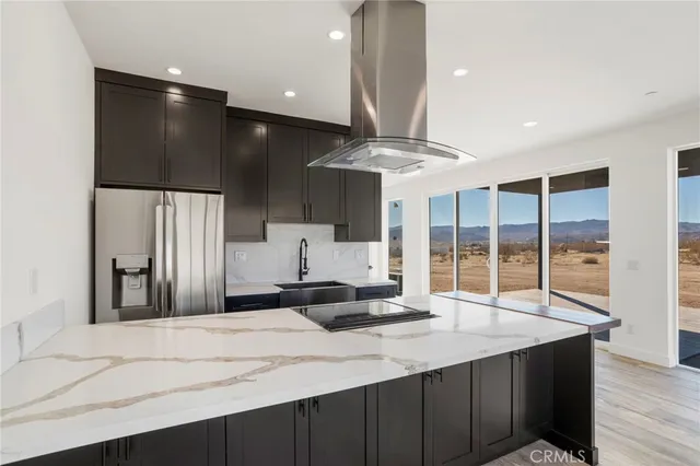 a kitchen with a sink stainless steel appliances and cabinets