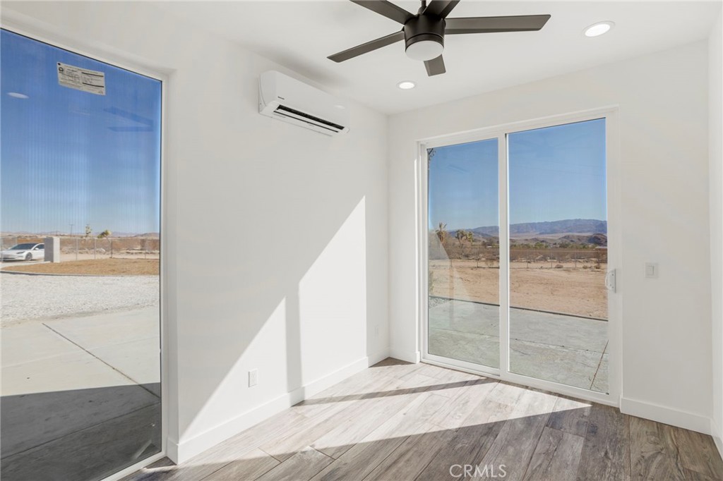 3460 Stonehill Avenue Joshua Tree, CA 92252 - Photo 10 of 27 a view of a hallway to a bedroom