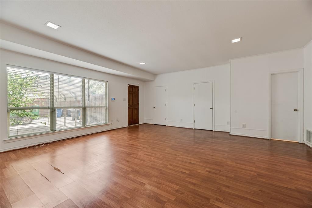 4988 Thunder Road Dallas, TX 75244 - Photo 14 of 32 Expansive living room featuring wood-finish flooring, white walls, and recessed lighting