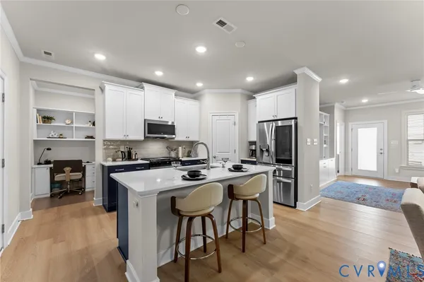 a view of a kitchen with appliances and cabinets