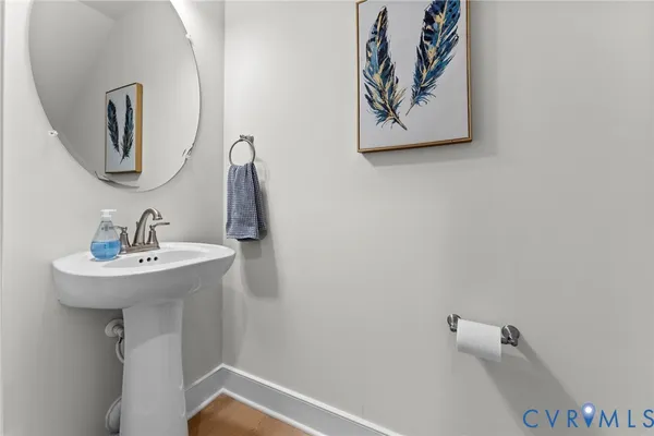 a bathroom with a sink and mirror