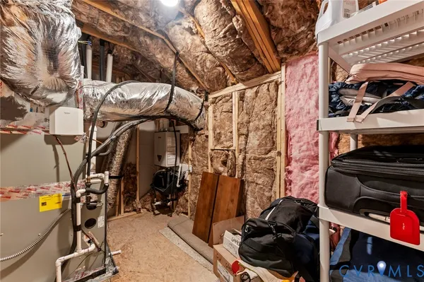 an aerial view of residential houses with outdoor space and ocean view